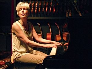 Lydia Adams Davis writing songs while on the piano