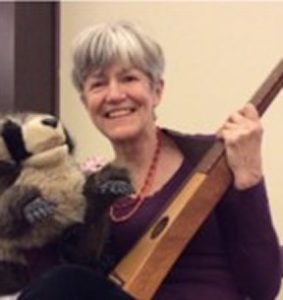 Lydia with dulcimer and Rocco Racoon